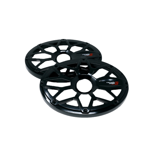 Two RPM Stroker 6"X9" black steel flush mount speaker grills with a geometric, spoke-like design overlap against a white background. Each grill features a small red and white logo, has a glossy finish, and includes multiple bolt holes around the central opening.