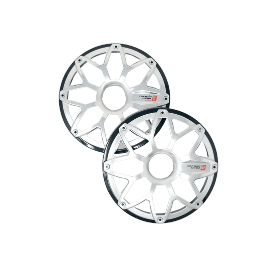 The RPM Stroker 6.5” Flush Mount Speaker Grill, Pair (Black) - SM65FGB features two black, multi-spoke grills with central metallic plates and logos. The angular spokes form a geometric pattern with thin edges, resembling the original design, slightly overlapping against a white backdrop.