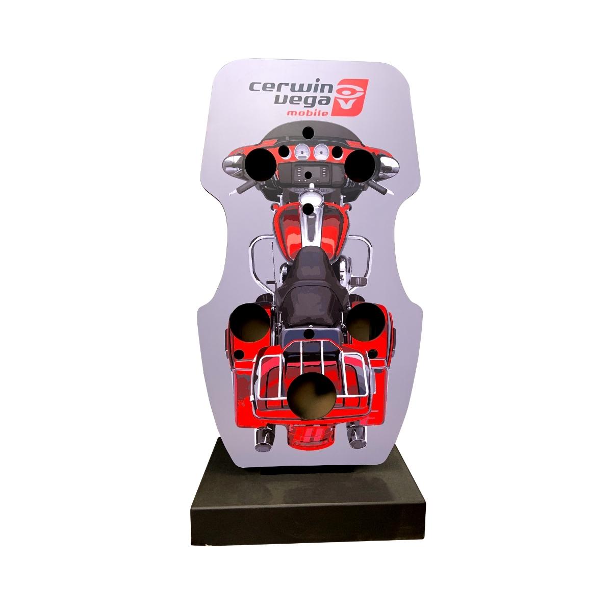 Display featuring the CER-DISBIKE, a motorcycle-shaped audio system with four speakers, in sleek red and silver design. "Cerwin Vega Mobile" branding tops it off, mounted elegantly on a black rectangular base.