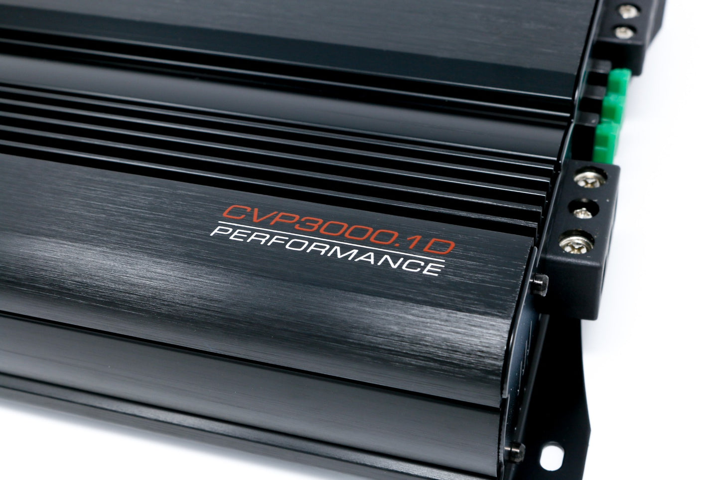 Close-up of a sleek, black CVP Amplifier with "CVP3000.1D PERFORMANCE" in orange and white. It features ribbed cooling sections, multiple terminals on the right with screws and green connectors, all on a brushed metal surface.