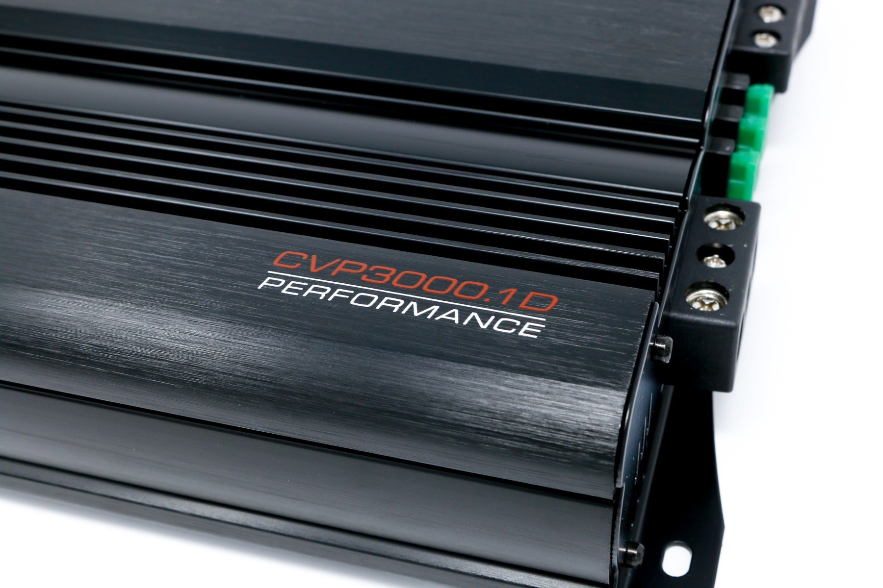 Close-up of a sleek, black CVP Amplifier with "CVP3000.1D PERFORMANCE" in orange and white. It features ribbed cooling sections, multiple terminals on the right with screws and green connectors, all on a brushed metal surface.