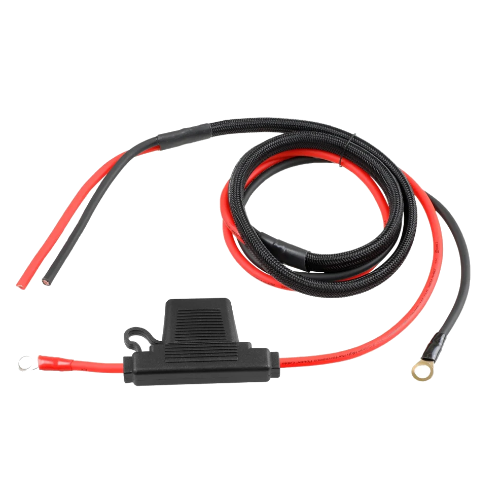 A coiled black and red power cable with a protective cover for a Harley Davidson harness kit includes a ridged cylindrical black component at one end and two metal ring terminals at the other, perfect for robust electrical connections with the CWHK - RPM Harley Davidson Power/Ground Remote Harness Kit.