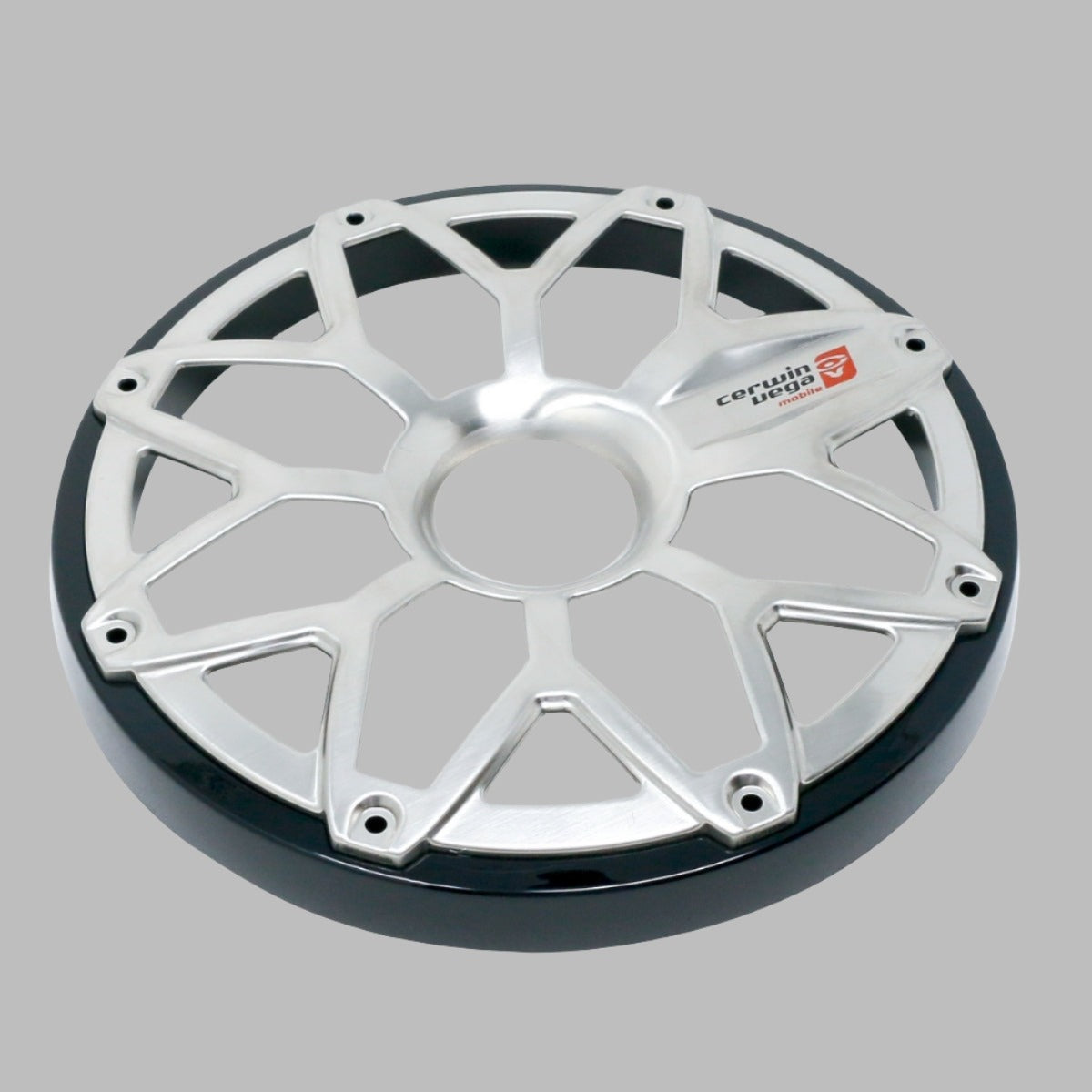 The image shows a silver metallic wheel cover with a design resembling the RPM Stroker 6.5” Flush Mount Speaker Grill. It features spoke-like eight-point extensions forming a star pattern, a shiny black rim edge, and the red and white "cerwudin line" logo on one spoke against the gray background.