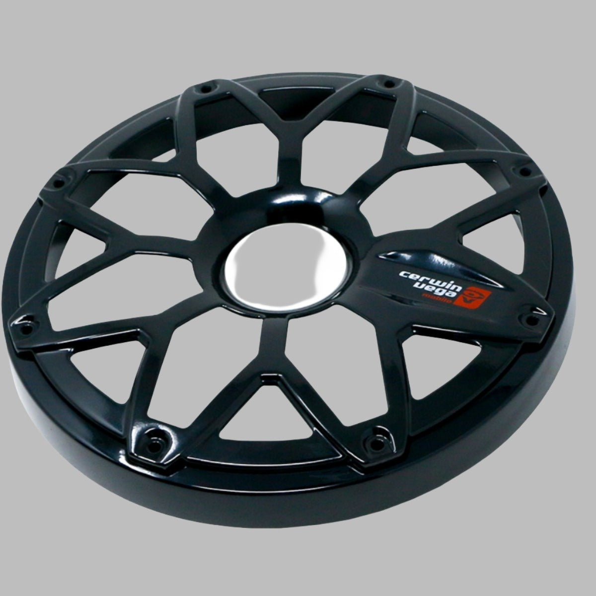 A black car wheel cover with a web-like design and central chrome features the RPM Stroker 8” Flush Mount Speaker Grill badge, including "cerwin vega" and a stylized red "3," adding style against a plain gray background.