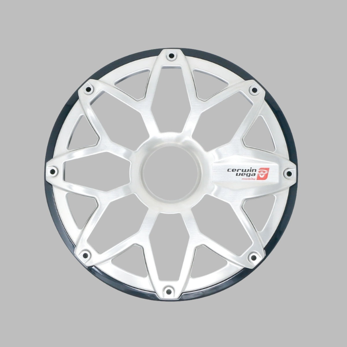 A silver and black star-shaped car wheel rim, resembling the RPM Stroker 8” Flush Mount Speaker Grill with its eight spokes and triangular cutouts, is displayed on a gray background. The glossy rim features the "Cerwin Vega" logo beside one spoke, enhancing its stylish appeal.