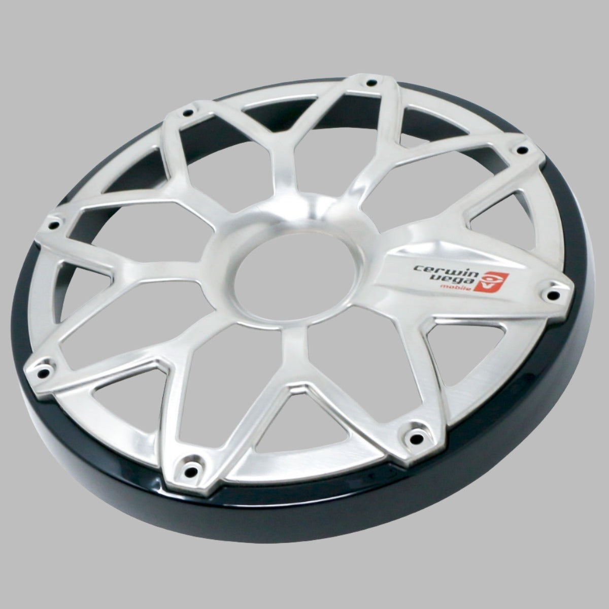 A sleek silver car wheel rim features a geometric, multi-spoke design on gray. The Cerwin Vega logo with a red insignia recalls an RPM Stroker 8” Flush Mount Speaker Grill. Six bolt holes offer style and function, while the smooth outer edge gleams metallic.