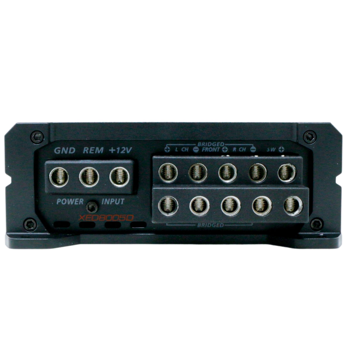 Close-up of a black amplifier terminal panel with labeled sections: "GND," "REM," "+12V," "Power," "Input," "Bridged Front," and channel options. The name "XED6005D" appears in red and white on the lower left, identifying it as an XED Amplifiers product.