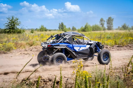 A UTV on a dirt road.