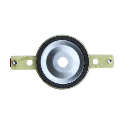 The CVPXTD, a replacement tweeter diaphragm for CVPX Series models, features a metallic dome with a central bulge bordered by a black rubber ring. It's attached to a beige bracket with dual holes and wires on each side against a white backdrop.