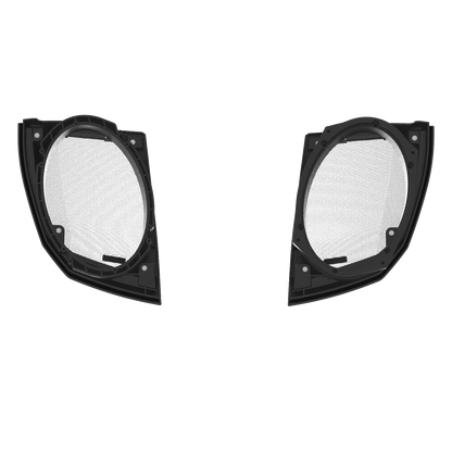 Two black semi-circular headlight trims resemble the 2024+ Harley Davidson® Cut-In Lid Kit with PH694 (4Ω) Speakers, symmetrically placed on a white background. The trims have a solid frame, visible mounts, and a mesh center for airflow or protection.