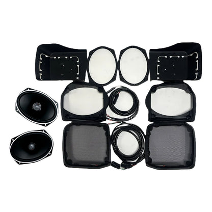 On a white backdrop, Cerwin Vega's 1998-2013 Harley Davidson® Cut-in Lid Kit showcases two black ST692CX2 oval speakers, four mesh covers, wires, mounting brackets, four white oval pads, and two protective covers arranged neatly.