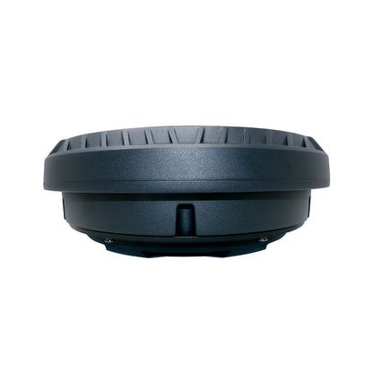 The Cerwin Vega VEGA 12" Shallow Spare Tire Powered Subwoofer - VPSTX12, resembling a black round ridged electronic spare tire, is viewed side-on against a white background. It features a flat top, tapering sides with a horizontal seam, and a small central protrusion typical of high-end car audio systems.