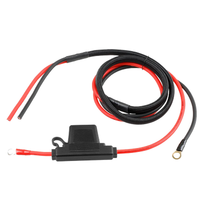 A coiled black and red power cable with a protective cover for a Harley Davidson harness kit includes a ridged cylindrical black component at one end and two metal ring terminals at the other, perfect for robust electrical connections with the CWHK - RPM Harley Davidson Power/Ground Remote Harness Kit.