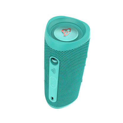 The VegaMini Bluetooth speaker, with a textured teal cylindrical design and circular top featuring a rainbow logo, delivers immersive audio. Its angled control panel includes buttons for power, Bluetooth pairing, and volume plus a charging port.