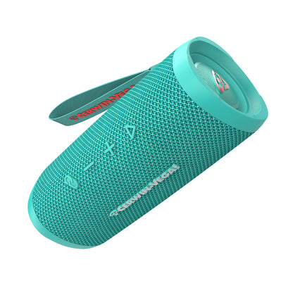 The VegaMini, a teal cylindrical Bluetooth speaker, delivers immersive audio with a textured finish and colorful right end cap. It features a carrying strap with red text and control buttons for power and volume.