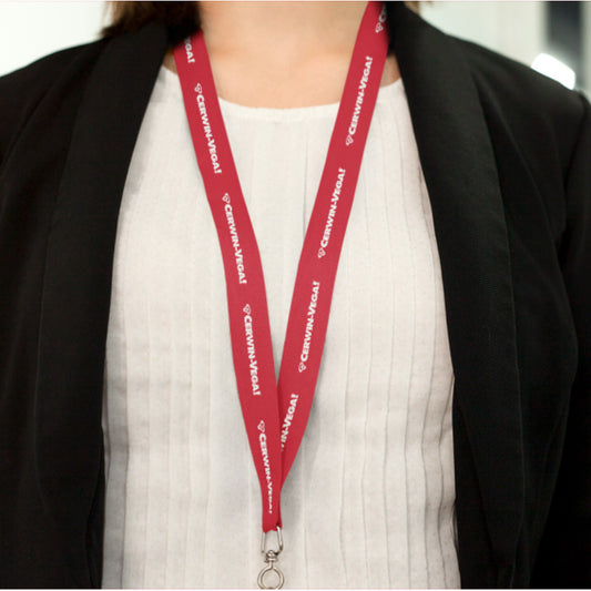 A person in a white top and black blazer wears a red CVMLANR Cerwin-Vega Mobile Lanyard with "CREWMARVEL" text. The lanyard, featuring a metal clasp, is captured in a photo from shoulders to waist.