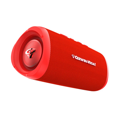 Seen from an angle, the VegaMini Compact Powerhouse Bluetooth Speaker is a red cylinder with a textured surface and top controls. "Cerwin-Vega!" is printed in white near the right speaker face, featuring a logo and concentric pattern, delivering an immersive audio experience.