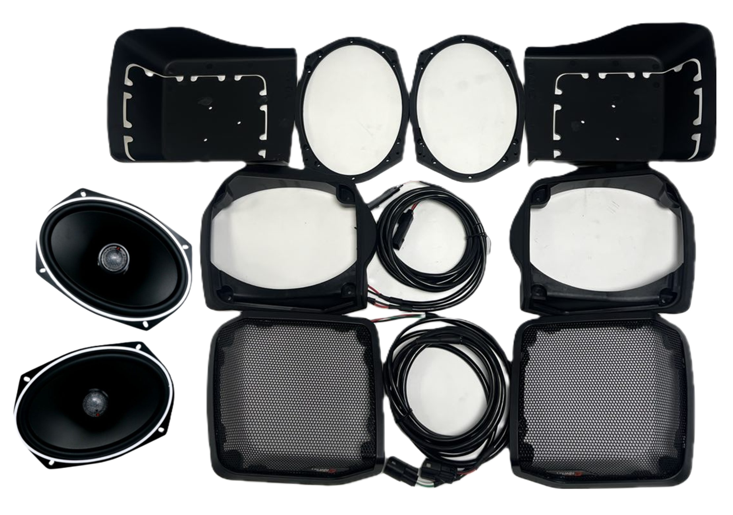 A Harley Davidson Lid Kit layout on a white background features two oval speakers, two round subwoofers, two rectangular speaker covers with mesh grilles, multiple black cables, and six black plastic mounting frames.